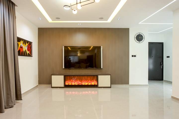 Living room with fireplace and media wall