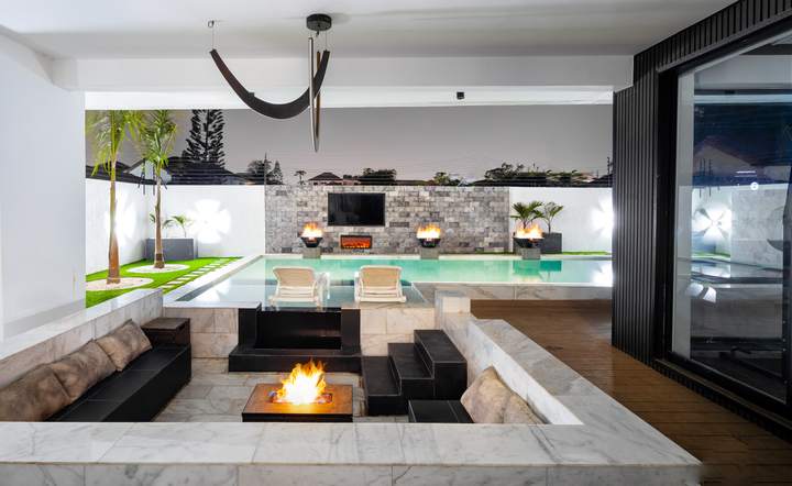 Sunken lounge with a fire pit beside the pool