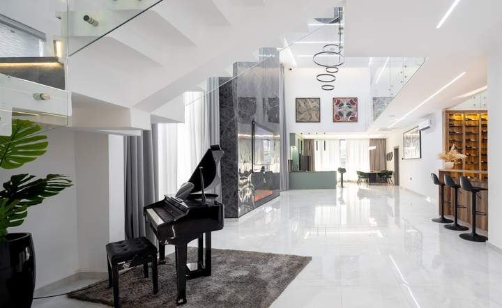 Lounge with a grand piano and double-height hall